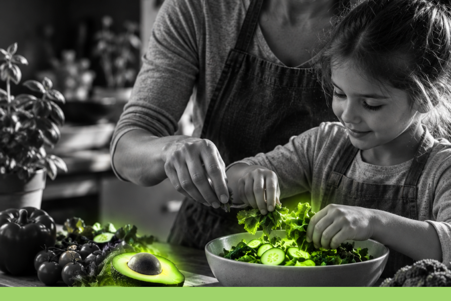 Adulto e bambina preparano insieme un pasto con verdure e alimenti freschi, con accenti verdi.